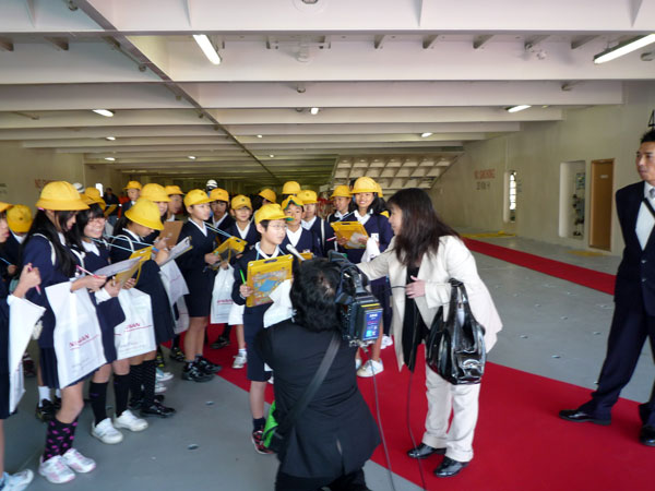 Children in front of a TV crew