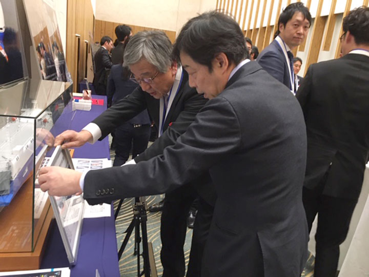 Mitsui-san Explaining His Products to the Vice Minister Mr. Aoki